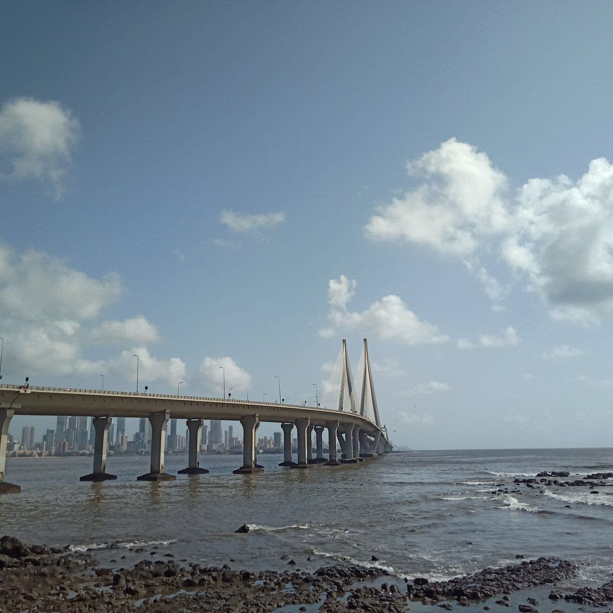 The Bandra–Worli Sea Link curving out across the water, Mumbai's skyline behind it.